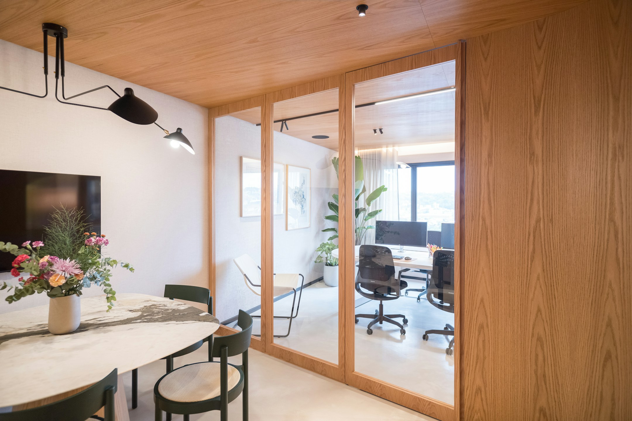 A modern office with floor-to-ceiling glass walls, the visual of transparency as architecture.