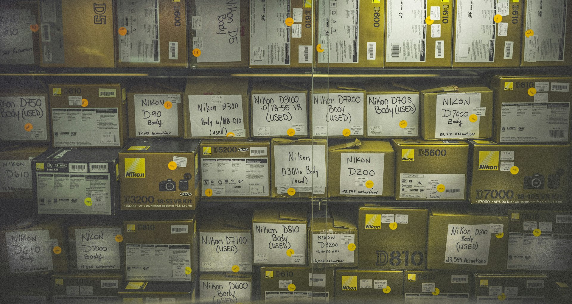 A row of identical sealed boxes on a shelf, the visual of per-user isolation where one box's contents cannot reach another's.