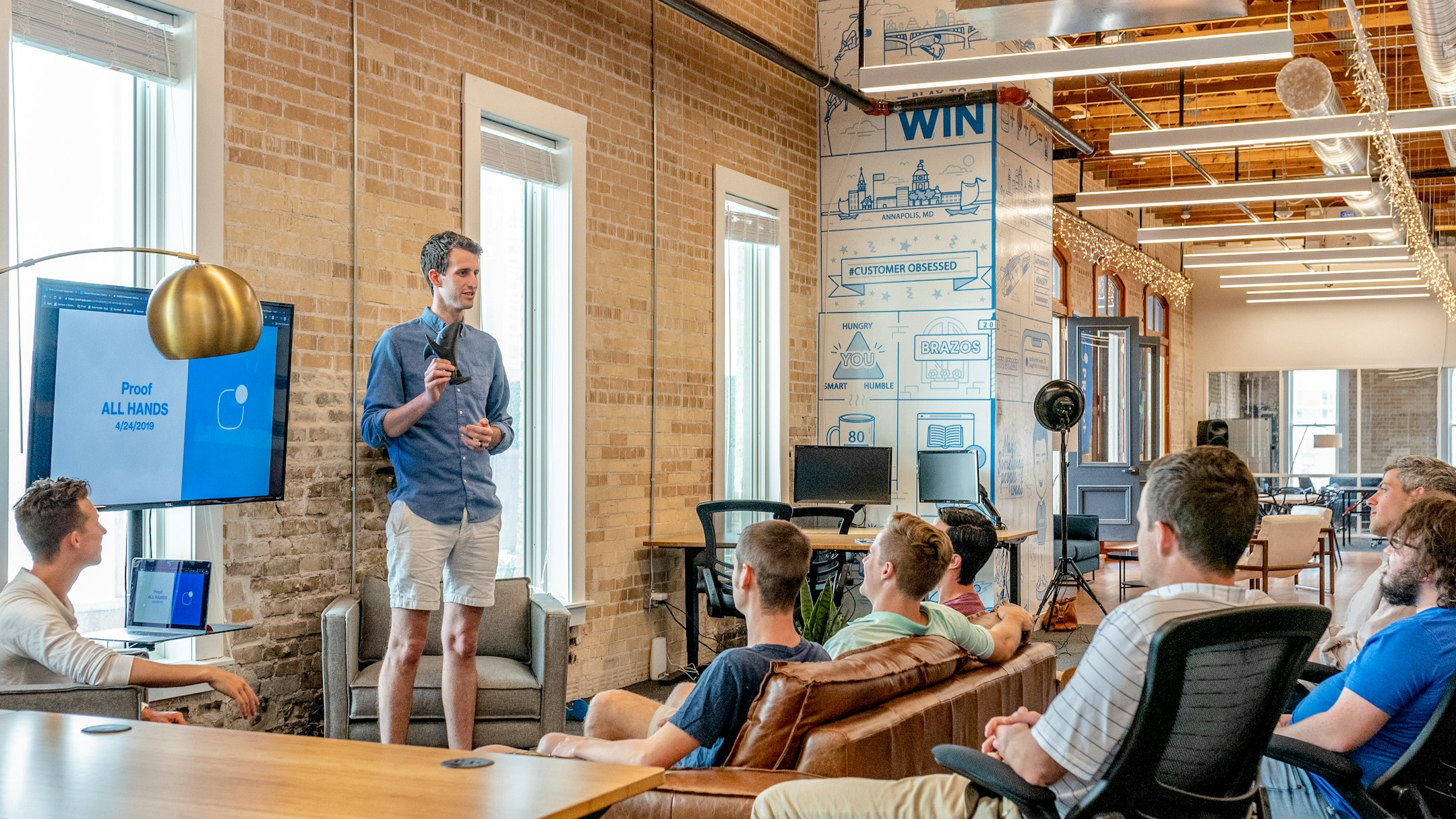 People in a meeting collaborating, the visual of distinct individuals collaborating across surfaces.