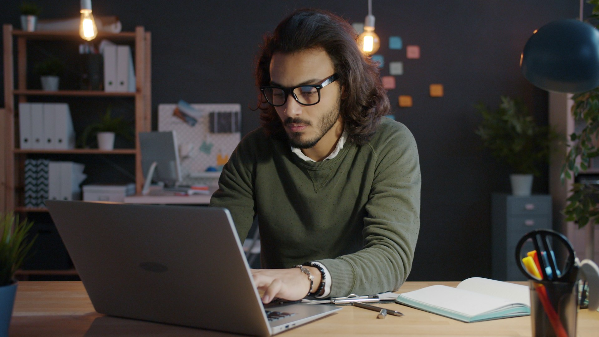 An open laptop in a quiet living room at night, the visual of the operational hours most non-engineers do not want to spend on agent setup.