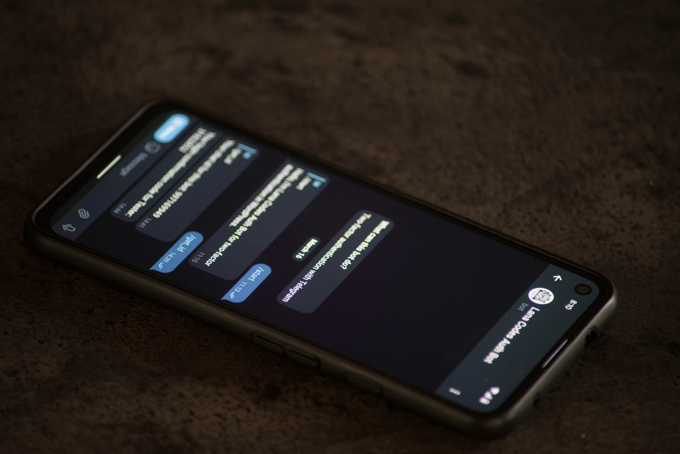 A close-up of a phone resting on a wooden table, screen dim, the symbol of an agent reachable in three seconds.